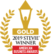 a gold logo with a person holding a triangle